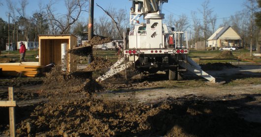 Green Valley Baptist Church sets the pilings for the new bunk house