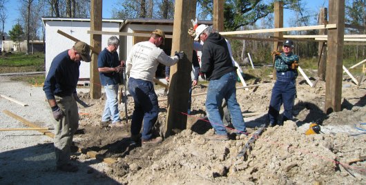 Green Valley Baptist Church sets the pilings for the new bunk house