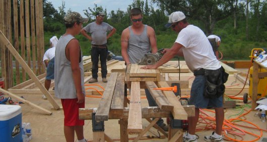 Locals erect Mercy House walls