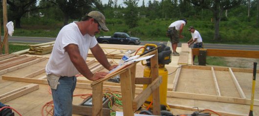 Locals erect Mercy House walls