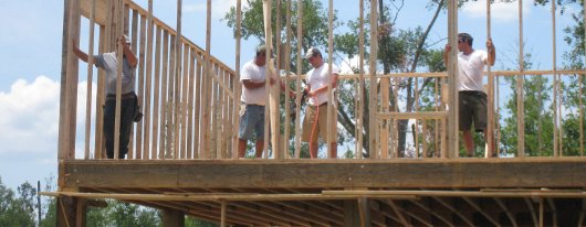 Locals erect Mercy House walls