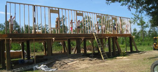 Locals erect Mercy House walls